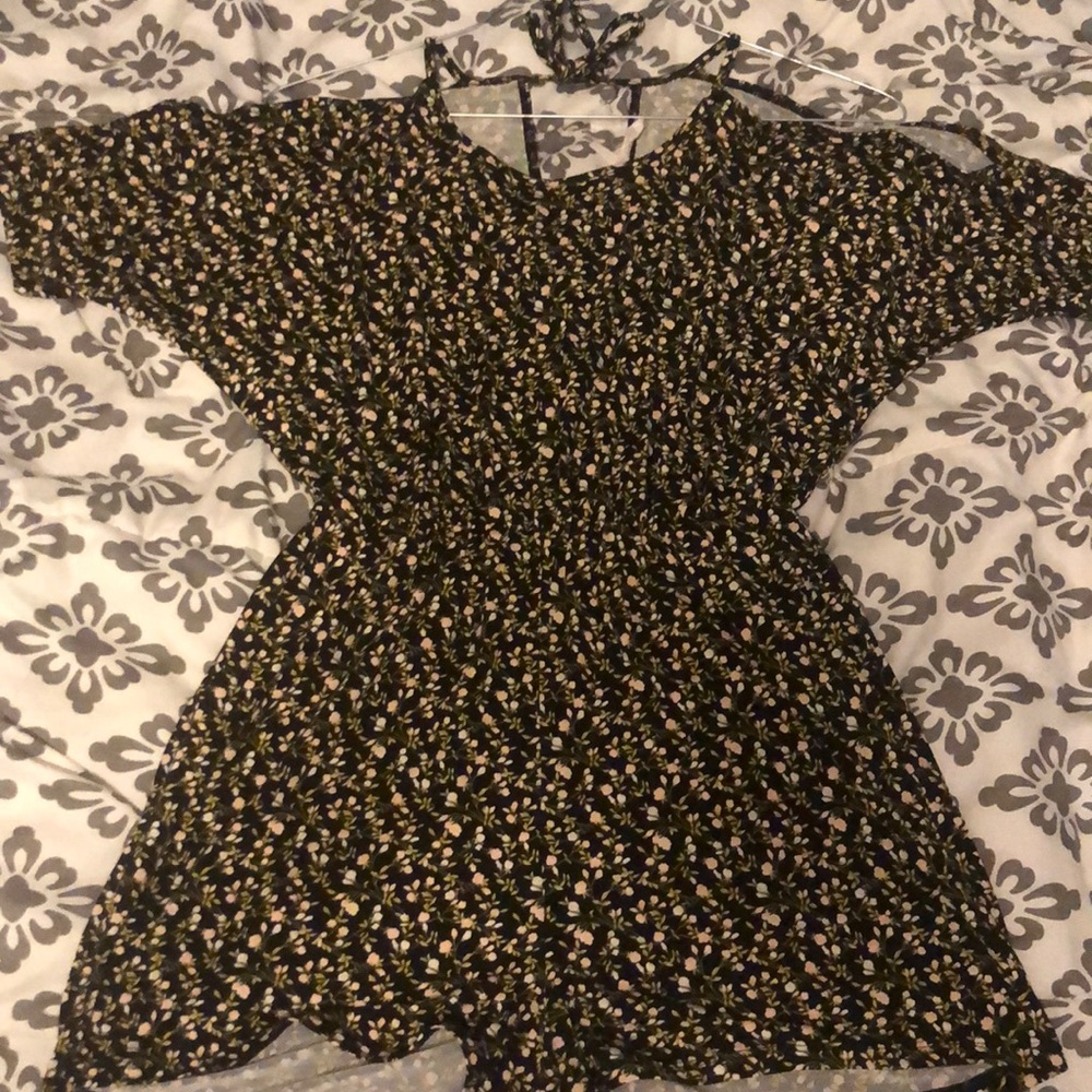 Black off the shoulder romper with flowers on it